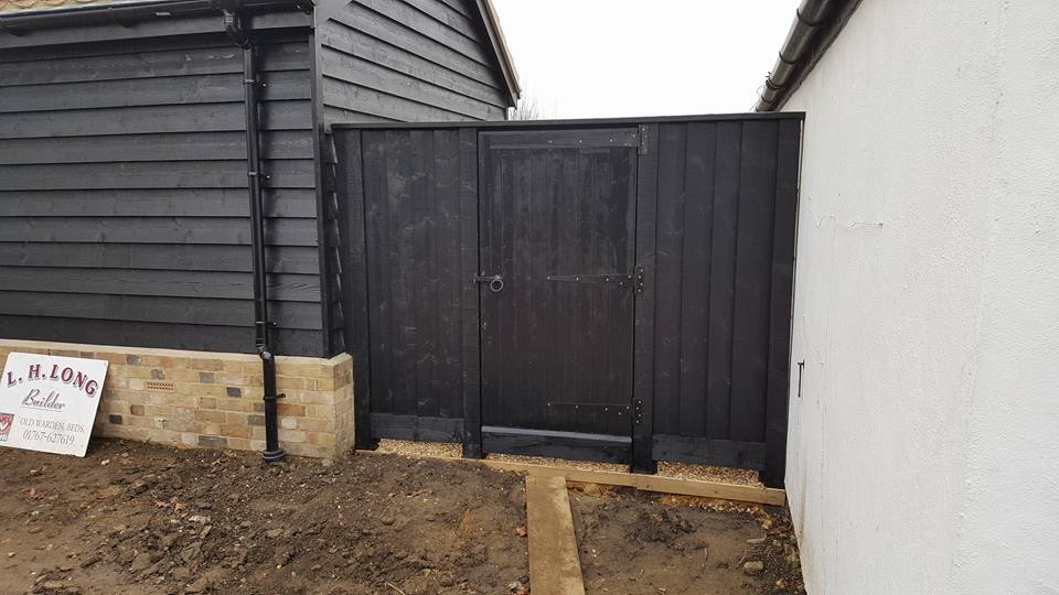 2 of 2: Extension being built, brick plinth, walls finished off with timber cladding and a pan tile roof, all done so as to keep in character with local area.